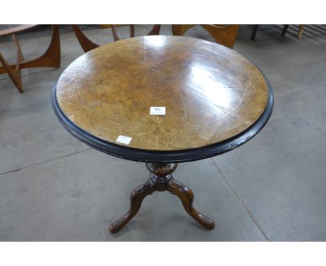 A Victorian inlaid walnut circular tripod table