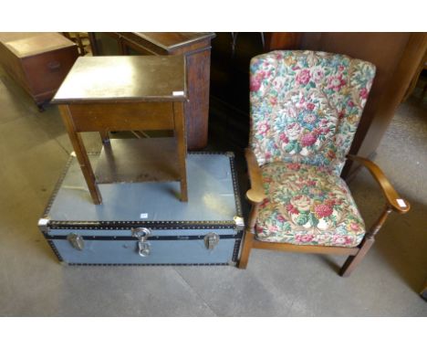 A steamer trunk, beech armchair and an oak sewing table