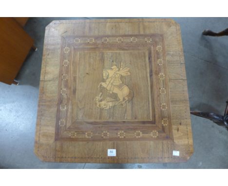 A Victorian mahogany tripod table, the square mahogany top inlaid with St. George and the Dragon