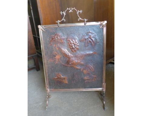 An Art Nouveau leather and copper fire screen