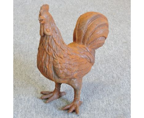 A cast iron model of a hen, 31cm tall