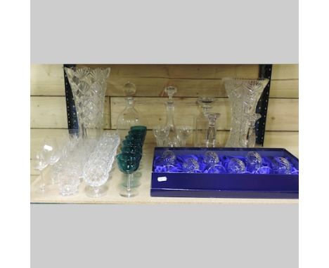 A shelf of crystal and glassware to include a set of Royal Doulton crystal glasses, boxed, decanters, vases etc