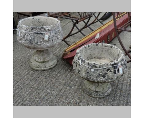 A reconstituted stone planter, on a column base, 48cm tall, together with another smaller