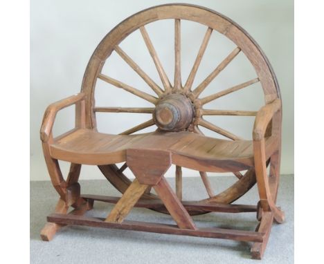 A hardwood cartwheel garden bench, 117cm