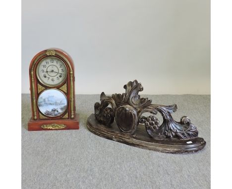 A mantel clock, with a painted dial, together with a carved shelf, 68cm