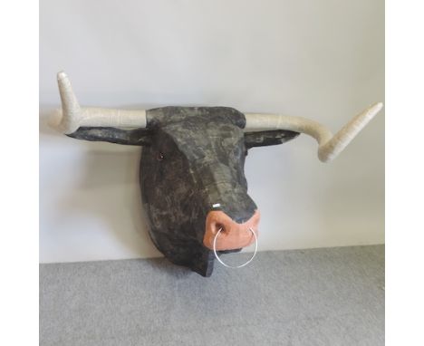 A large painted papier mache model of a bull's head, 115cm 