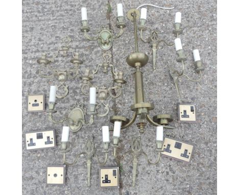 A collection of ornate brass wall lights, together with a brass ceiling light