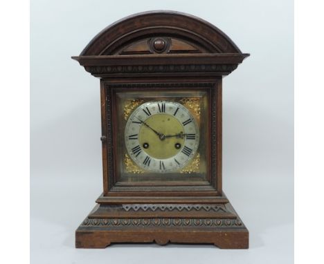 An early 20th century oak cased bracket clock, with a brass dial, striking on a gong, 37cm tall