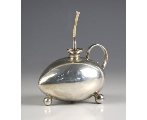 A Victorian novelty silver table lighter, James Deakin and Sons, Chester 1900, the heart shaped body with looped handle, upon