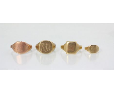 A group of four yellow metal signet rings, including two examples with engraved monogram to head, ring size R, with a plain p