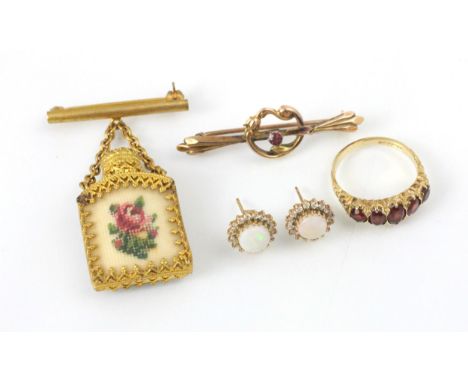 A selection of jewellery, including a 9ct yellow gold untested garnet set ring, in Victorian style, ring size O, a hollow yel