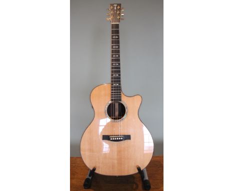 A 2009 Martin GPCP1A Aura electrics acoustic guitar, made in USA, serial number 1403205, within fitted hard caseCondition rep