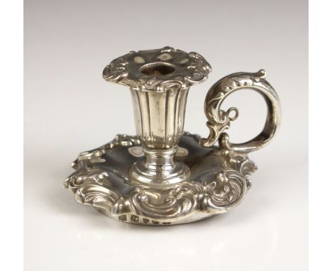 A Victorian silver taper stand, Henry Wilkinson and Co, Sheffield 1850, the cast floral removeable drip pan above urn shaped 