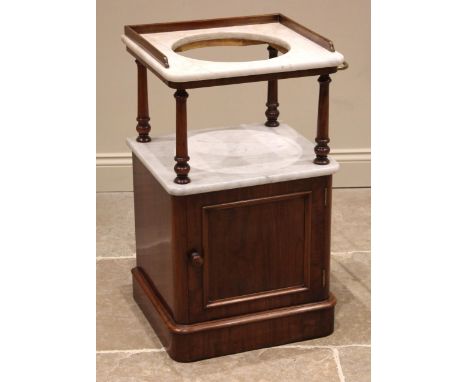 A Victorian mahogany and marble wash stand, the white marble top with a three quarter gallery and central bowl aperture, upon