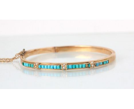A French yellow gold and turquoise set bangle, the central panel with mixed cut turquoise and pearl detail, box and tongue fa