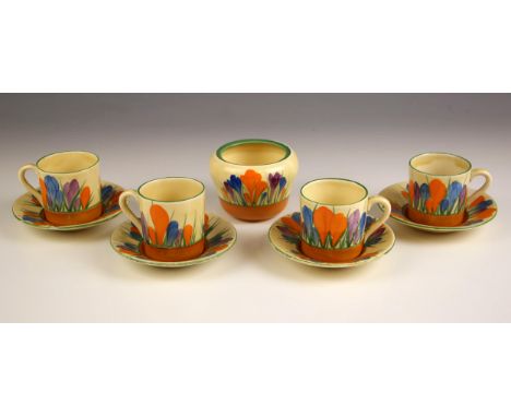 A Clarice Cliff Bizarre range part coffee service in the 'Crocus' pattern, comprising: four coffee cans, four saucers and a s