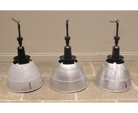 Three Simplex aluminum industrial light shades, mid 20th century, of typical domed form, below a painted iron pendant fitting