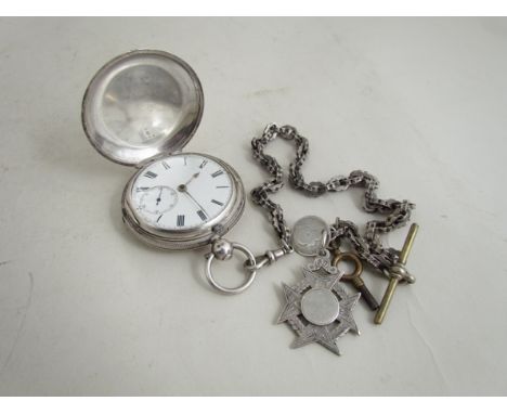 A silver full hunter pocket watch with white enamel dial, Roman numerals and subsidiary seconds dial, on link watch chain wit