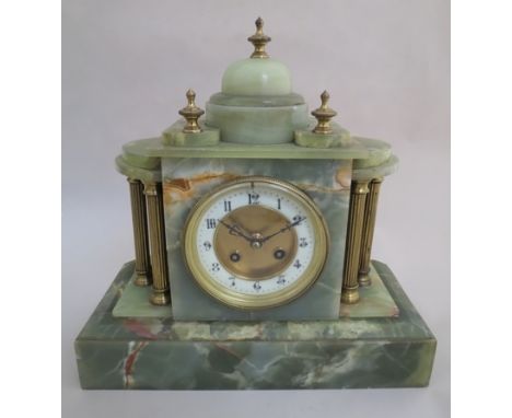 An onyx mantel clock of architectural form, Arabic dial with brass columns and finials, 8 day movement 