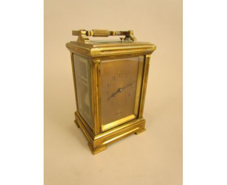 An ACC repeating brass carriage clock with Arabic numerals and alarm wheel (door loose)14.5cm high (excluding handle)