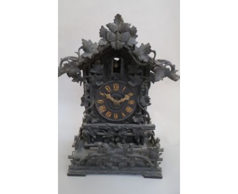 A Black Forest cuckoo mantel clock, 40cm high  