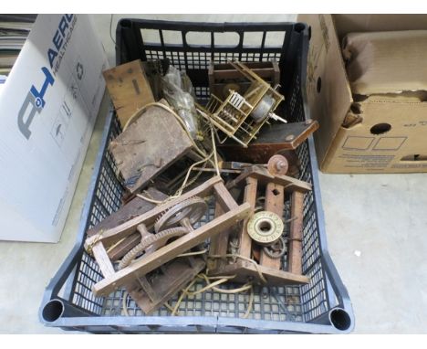 A box of postman's alarm clock movements etc 