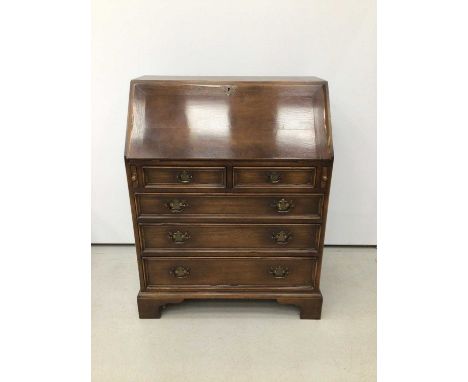 Oak bureau with fitted interior, two short and three long graduated drawers on bracket feet H98, W80, D44cm