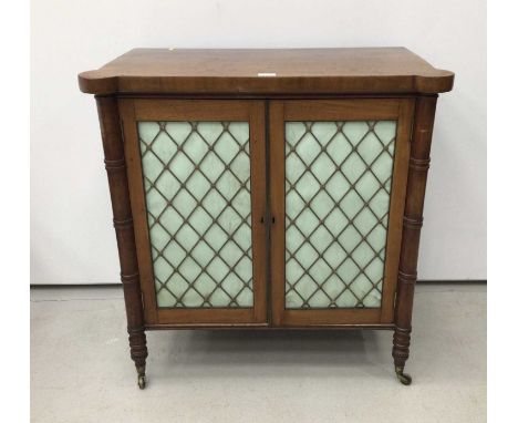 Victorian mahogany chiffonier with fabric lined grille doors enclosing one fixed shelf on turned feet with brass capped casto