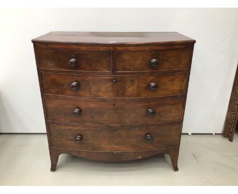 Georgian mahogany bow front chest of tow short and three long drawers with bun handles, on splayed bracket feet, 104cm wide x