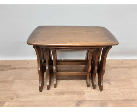 Nest of three Ercol elm tables, largest is 57cm wide, 35cm deep, 42cm high
