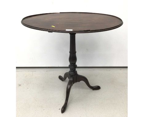 19th century mahogany tripod wine table, the oval top raised on turned column and three splayed legs, 69cm x 47cm