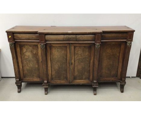 Regency mahogany break front sideboard with raised shelf back, with three drawers and cupboards below standing on splayed fro