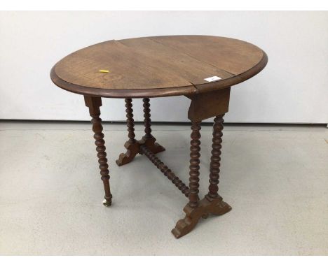 Edwardian mahogany Sutherland table with oval drop-flap, on bobbin turned supports, 66cm when open x 53cm wide x 50cm high