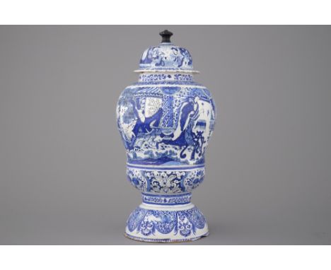 An unusual large Dutch Delft chinoiserie urn and cover, 17th C. The finial replaced by a wooden finial. H: 39 cm