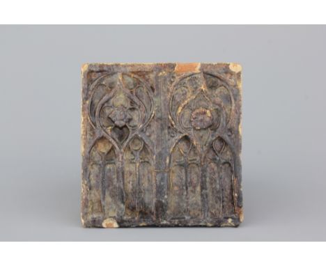A German brown-glazed architectural stove tile, 16th . Ca. 18 x 17,5 x 7,5 cm. 