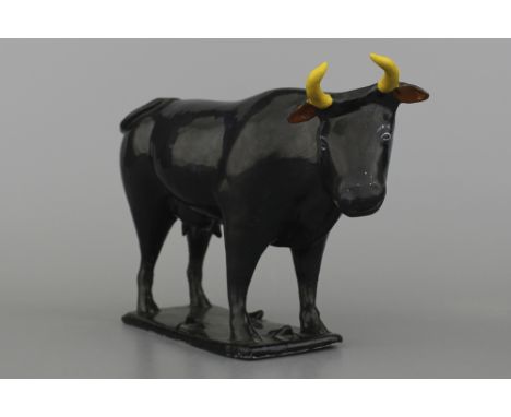 A rare Dutch Delft black cow, ca. 1720 Size: L: 21 cm, H: 15 cm. Condition: Some restoration to the horns and ears. Provenanc