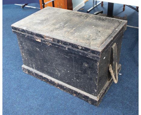 A heavy black tool chest fitted with sections of drawers comprising some wood working tools including Planes, Chisels etc, he