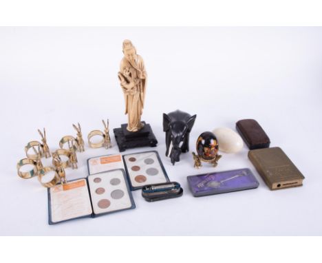 Various ornaments including figures, ebonised elephants, napkin rings, vintage miniature cased syringe, decimal coin sets, et