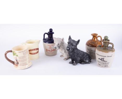 A small collection to include four small Scotch Whisky jugs, black and white Scottie dogs figures, a musical jug 'Cockington 