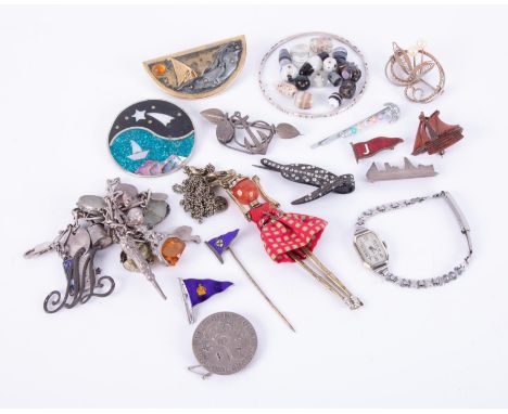 A mixed lot of brooches, including silver boat brooch (Plymouth), charm bracelet, silver omnibus brooch, silver &amp; enamel 