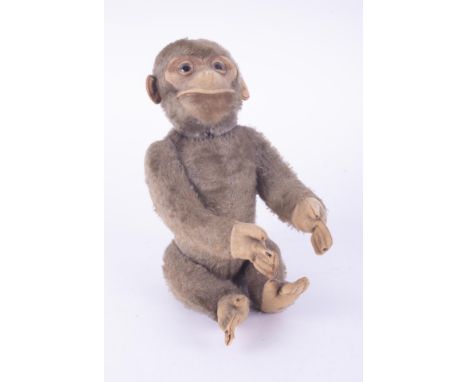 A vintage stuffed mohair? yes/no monkey with a moveable tail that operates the head from side to side &amp; up &amp; down, po