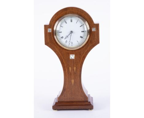 An Art Nouveau mahogany and mother of pearl inlaid mantle 'waisted' clock, French movement, with key, 30cm.