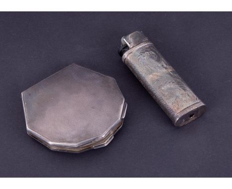 A silver cased lighter with scrolling leaf detail (40gms) together with a George V silver compact (70gms).