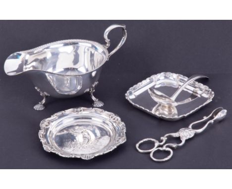 A Mappin &amp; Webb silver sauceboat, small ladle, pin dish with embossed Art Nouveau decoration and another pin dish, 9cm x 