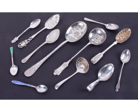 An assortment of ten silver spoons including caddy spoon, pierced silver sifter, jam spoon, enamelled tea spoons together wit