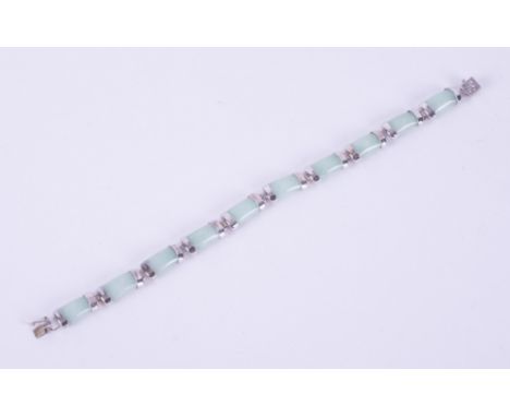 A silver bracelet set with 20 carats of genuine Jade, from Gemporia and comes with a Certificate of Authenticity and a gift p
