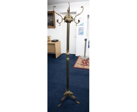 An ornate brass coat stand on tripod base, 167cm height.