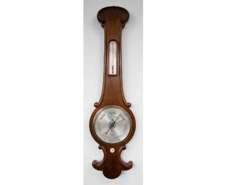 An early 20th Century Negretti &amp; Zambra, London, oak cased barometer with thermometer fitted, length 94cm.