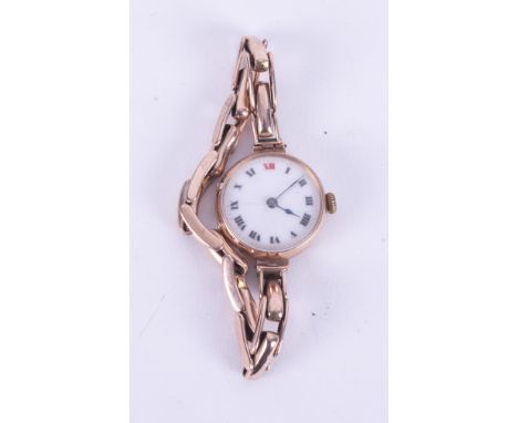 A vintage ladies 9ct gold cased wristwatch, mechanical movement with red twelve dial, approx. 23.5g.