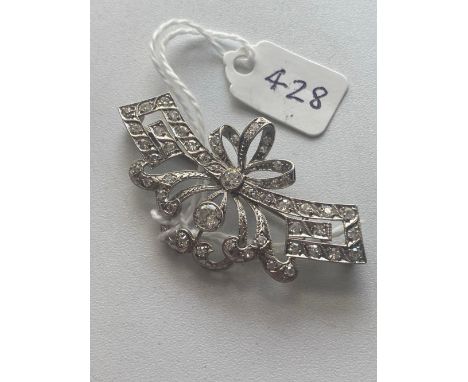 A ART DECO DIAMOND SET BROOCH DESIGNED WITH KEY PATTERN AND BOW LARGEST DIAMOND 0.45 CARAT 10.5 GMS